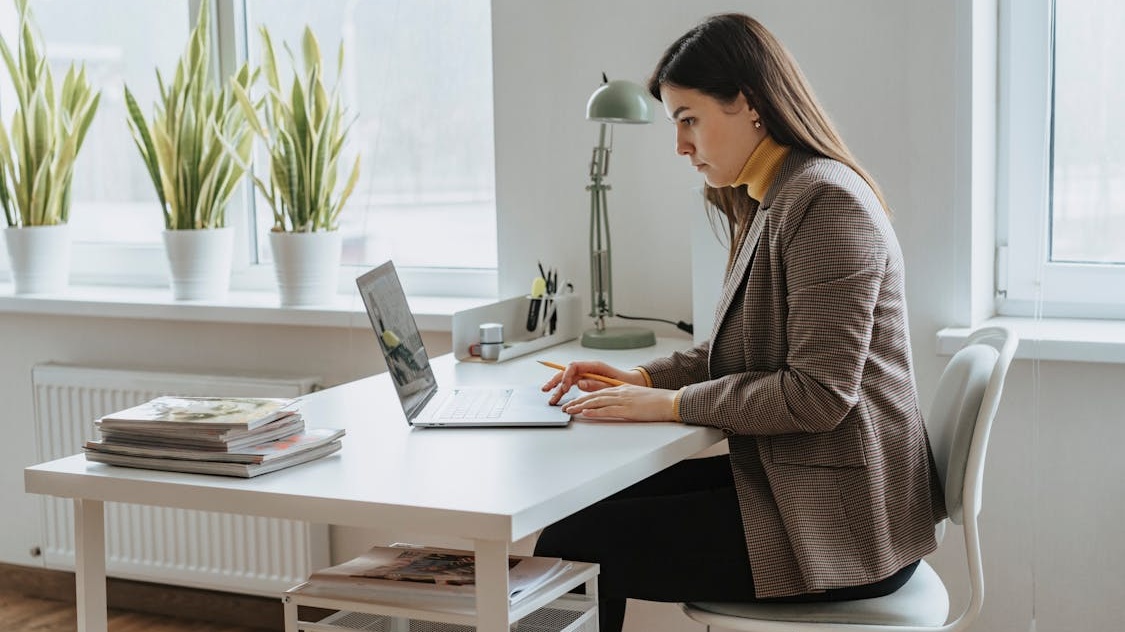 Professional accountant working at a modern office desk